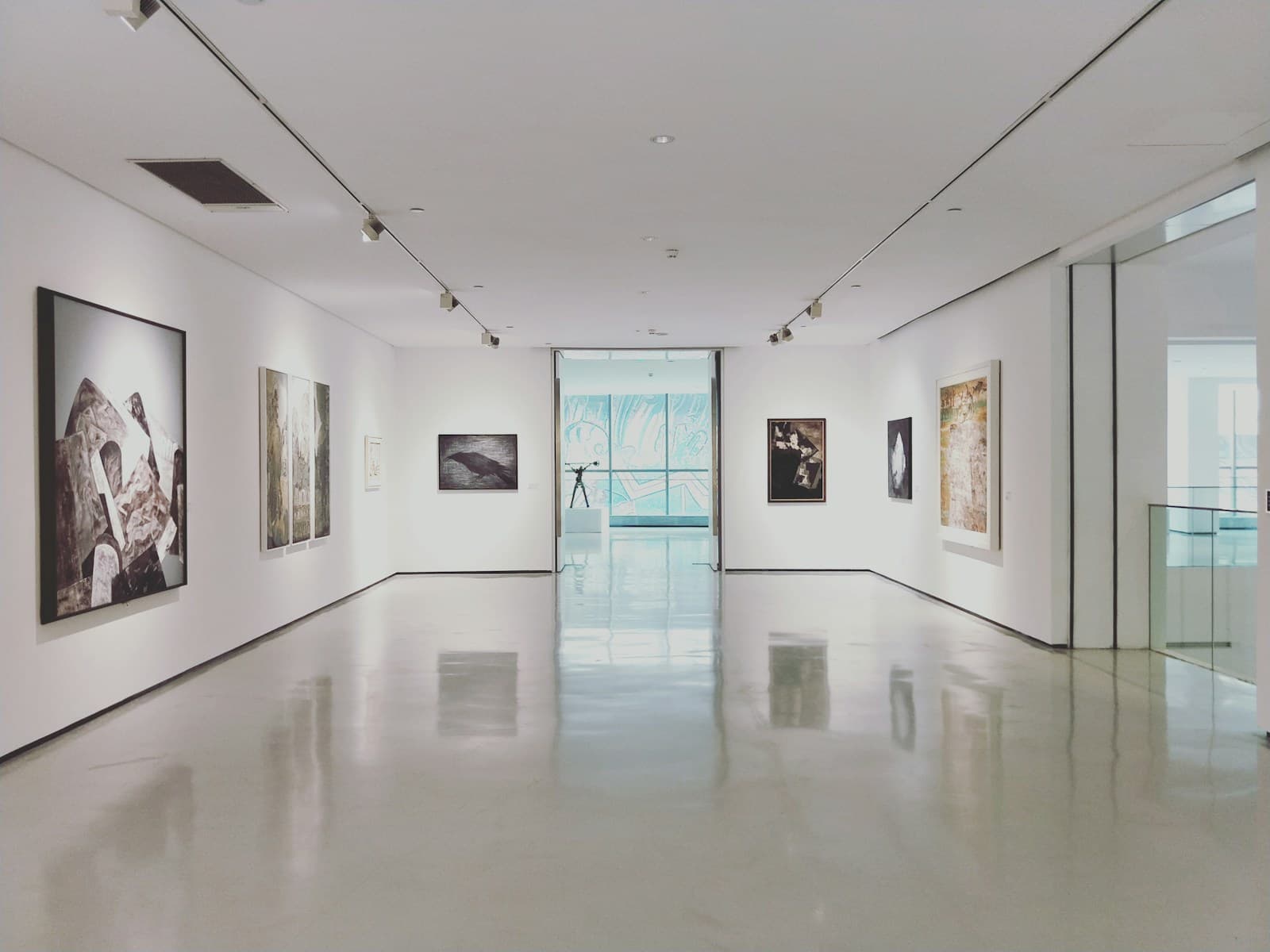 Art-walk theme photograph: paintings and sculptures in a white gallery